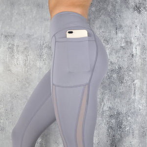 Women wearing quick dry mesh splice leggings in various colors for fitness and yoga