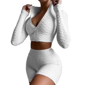 Women's yoga workout set with long sleeve zipper top and high waist shorts in multiple colors