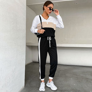 Black women's sporty hoodie and pants two-piece set with contrast color design