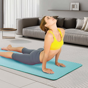 Green non-slip TPE yoga mat measuring 72 by 24 inches for Pilates and fitness exercises