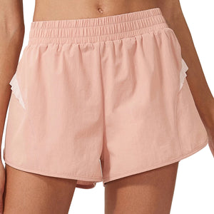Women's loose mid waist sports shorts in black, silver powder, and moon white colors