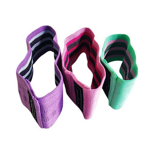 Set of 3 resistance loop bands in green, pink, and purple with carrying bag