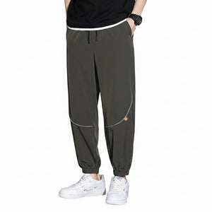 Men's tapered casual pants in gray, black, and army green colors