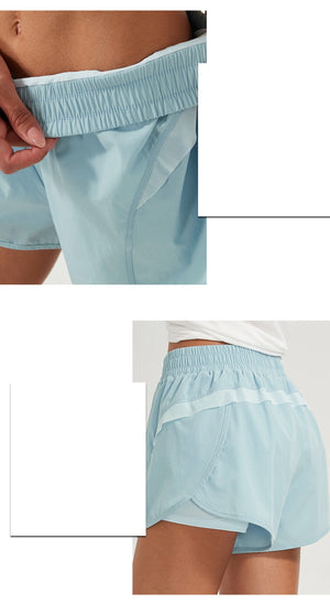 Women's loose mid waist sports shorts in black, silver powder, and moon white colors
