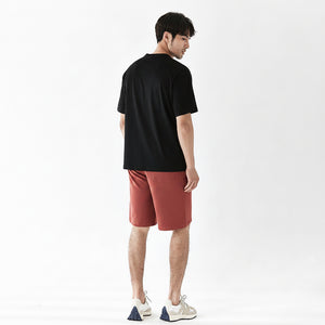 Men's heavy cotton mid-waist shorts in various colors including black, red, and blue