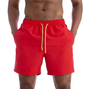 Men's cotton mid-waist beach shorts in assorted solid colors