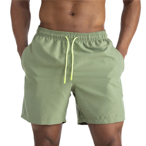 Men's cotton mid-waist beach shorts in assorted solid colors