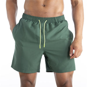 Men's cotton mid-waist beach shorts in assorted solid colors