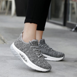 Women's breathable flyknit athleisure shoes in multiple colors with rubber sole and air cushion