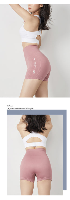 Women's tight fitting fitness yoga shorts in army green, sand pink, twilight blue, and mysterious black