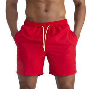 Men's cotton mid-waist beach shorts in assorted solid colors