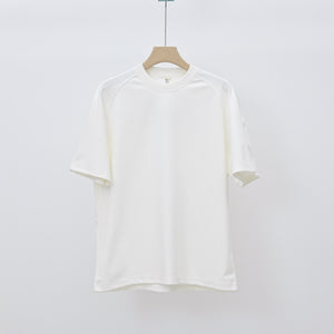 Men's loose-fit patchwork t-shirt in assorted colors with short sleeves and appliqué detailing