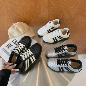 Women's versatile lightweight training sneakers in black, silver, and beige with lace-up closure