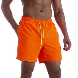 Men's cotton mid-waist beach shorts in assorted solid colors