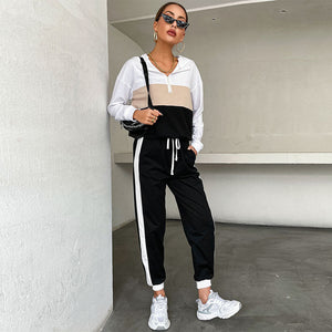 Black women's sporty hoodie and pants two-piece set with contrast color design