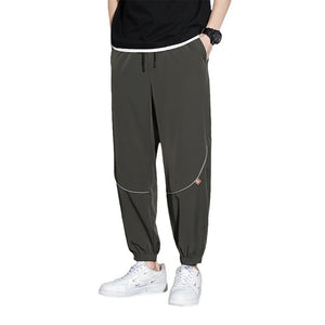 Men's tapered casual pants in gray, black, and army green colors