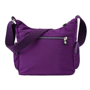 Waterproof nylon women's crossbody shoulder bag in various colors with multiple pockets