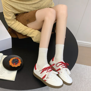 Women's casual leather running sneakers in multiple colors with rubber sole and lace-up closure