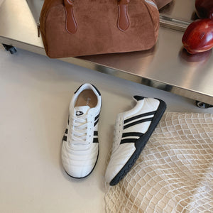 Women's versatile lightweight training sneakers in black, silver, and beige with lace-up closure