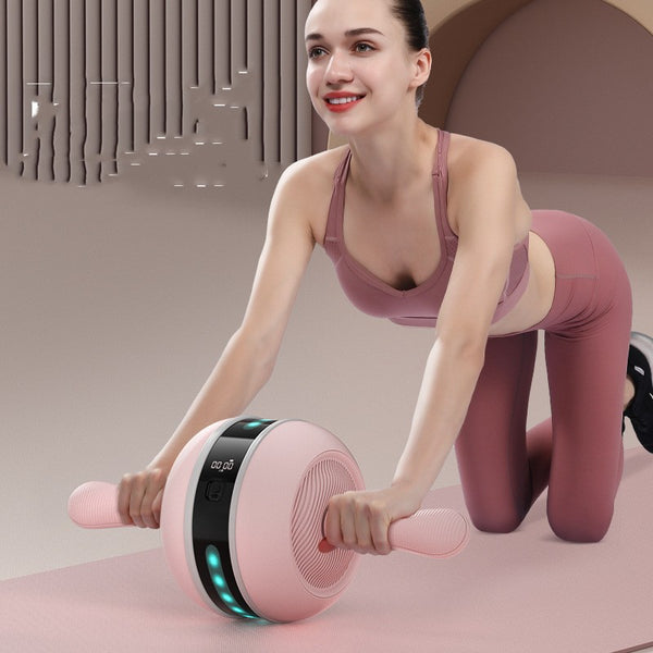Silent intelligent abdominal wheel in pink and white with lighting effect for home fitness