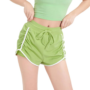 Women's three-quarter length sports shorts in black, milk white, and grass green