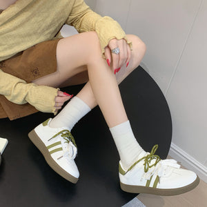 Women's casual leather running sneakers in multiple colors with rubber sole and lace-up closure
