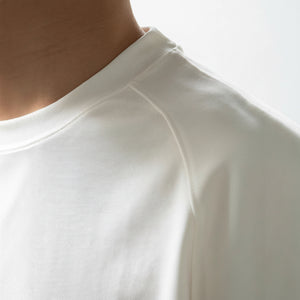 Men's loose-fit patchwork t-shirt in assorted colors with short sleeves and appliqué detailing