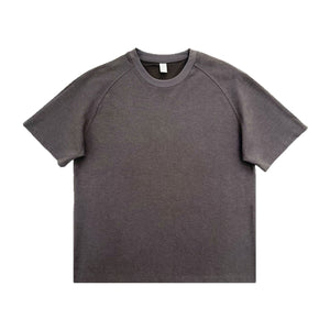 Men's loose-fit patchwork t-shirt in assorted colors with short sleeves and appliqué detailing