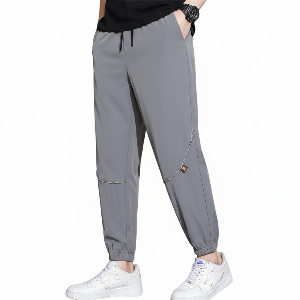 Men's tapered casual pants in gray, black, and army green colors