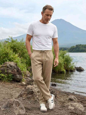 Men's stretch anti-wrinkle casual pants in black shown from multiple angles