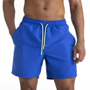 Men's cotton mid-waist beach shorts in assorted solid colors