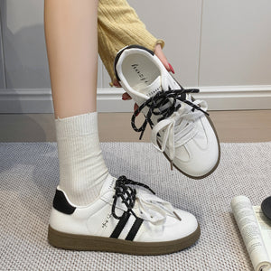 Women's casual leather running sneakers in multiple colors with rubber sole and lace-up closure