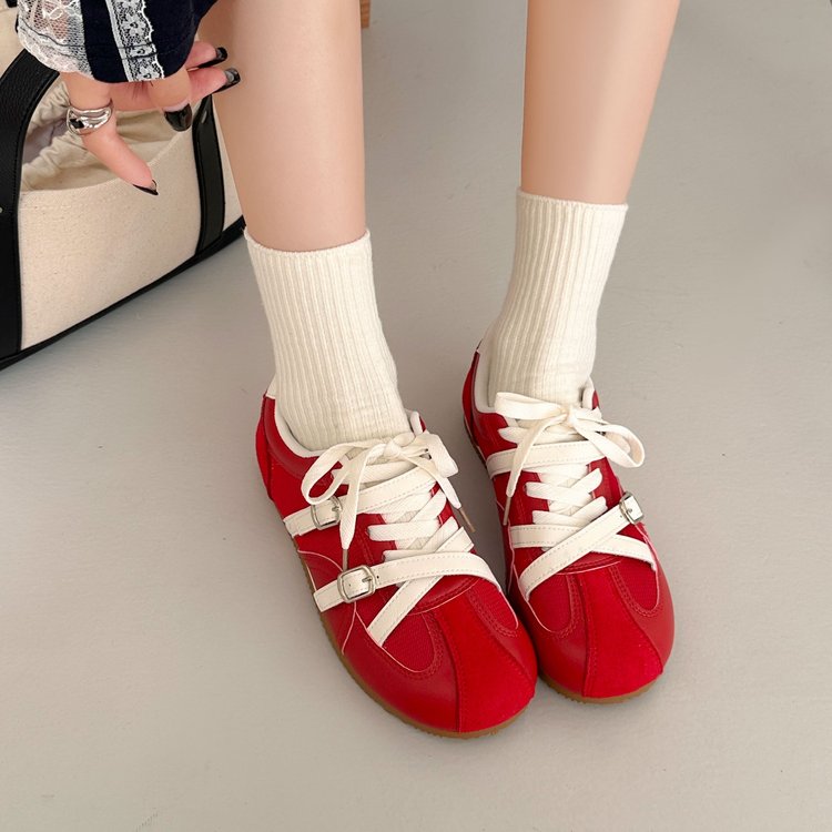Women's retro high rise thick soled training shoes in red and beige with lace-up closure