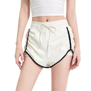 Women's three-quarter length sports shorts in black, milk white, and grass green
